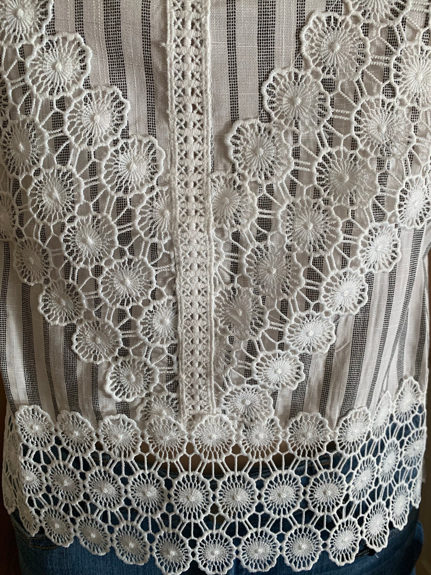 Sleeveless Eyelet Embroidered Hem Top